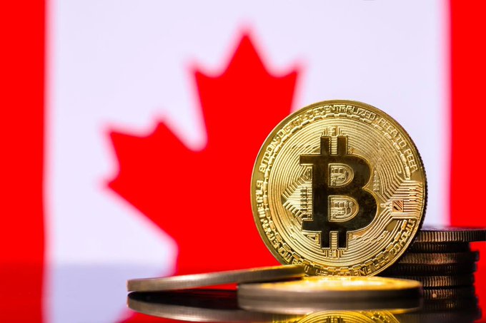A gold Bitcoin coin stands prominently on a reflective surface in front of the Canadian flag, with the inscription "BITCOIN DIGITAL" visible around its edge. The image visually represents the intersection of cryptocurrency and Canadian banking, aligning with the news that Canada has recognized bank-issued crypto deposits as legally equivalent to traditional bank deposits.