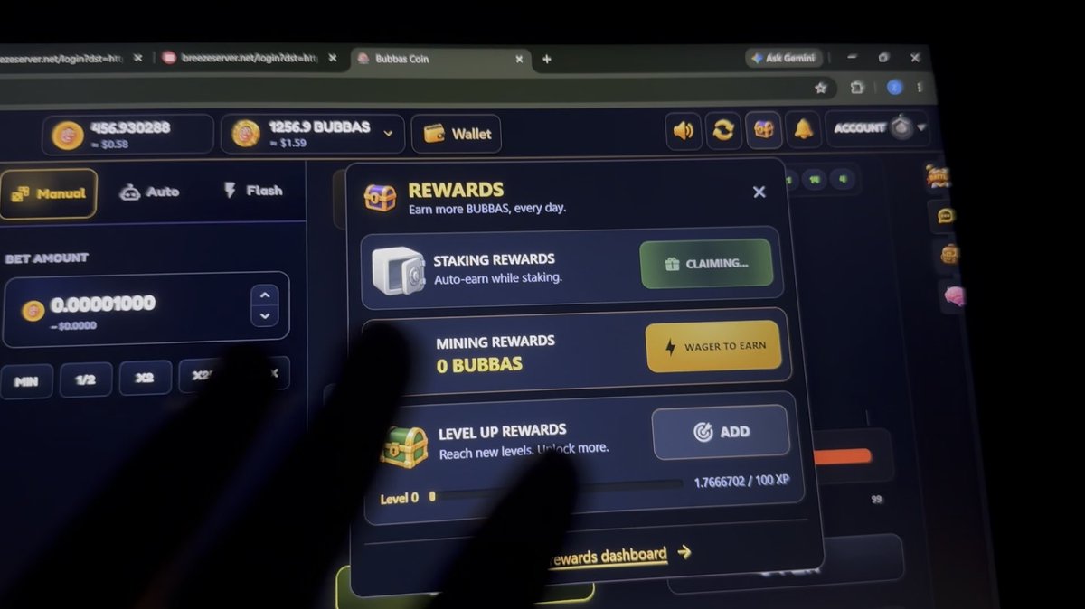 Screenshot of a crypto gambling/staking interface on breezeserver.net showing 'Bubbas Coin' with a balance of 1256.9 BUBBAS and a rewards popup displaying options for Staking Rewards (claiming), Mining Rewards (Wager to Earn), and Level Up Rewards at Level 0 with 1.7666702/100 XP.