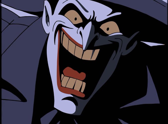 A close-up animated image of a sinister, grinning character with sharp teeth and a pointed nose.