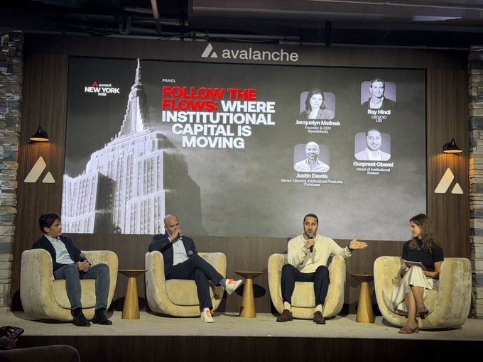 A panel discussion at an Avalanche 'Follow the Flows: Where Institutional Capital is Moving' event in New York, featuring speakers Justin Daada (Cointime), Jacqueline McKenzie, Ray Hindi (HSO), and Gurpreet Oberoi seated on stage.