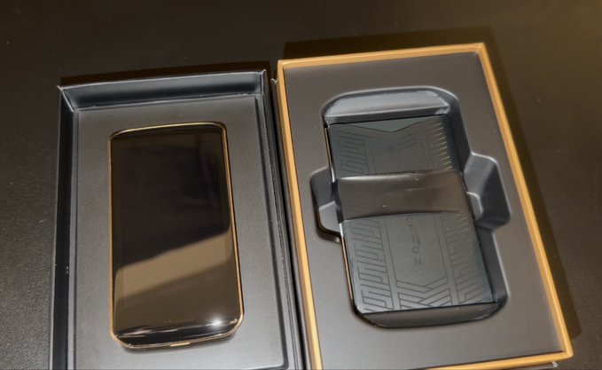 Two black electronic devices in open boxes, with the right box displaying 'TILON' branding on the device.