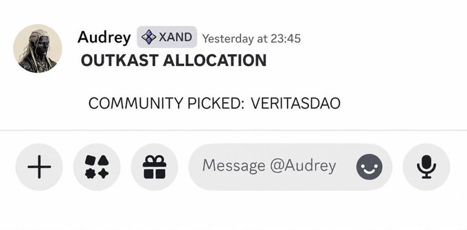 A messaging app screenshot showing a message from user 'Audrey' with the XAND handle announcing 'OUTKAST ALLOCATION' with 'COMMUNITY PICKED: VERITASDAO' sent yesterday at 23:45.