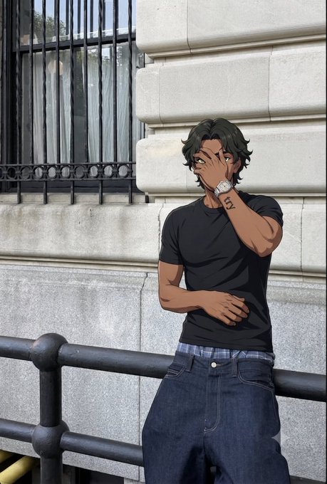 A stylized digital illustration of a young man with dark wavy hair wearing a black t-shirt and jeans, covering his face with his hand while leaning against a stone building with iron railings.
