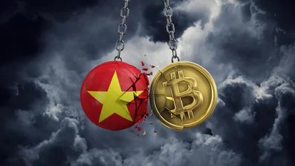 Conceptual image showing the Vietnam flag depicted as a cracked red sphere with a yellow star colliding with a golden Bitcoin coin on chains against a stormy cloud background.