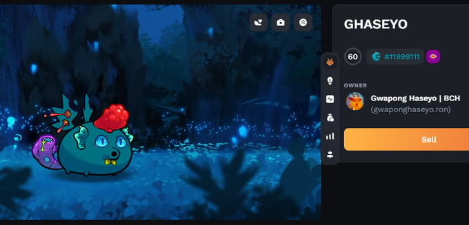 The image shows a cartoon character with a red hat, possibly a dragon or a monster, sitting in front of a screen displaying a video game interface. The character appears to be looking at something off-screen, which could be an enemy or another player's actions within the game. The background features a dark and mysterious setting, adding to the overall atmosphere of the scene.