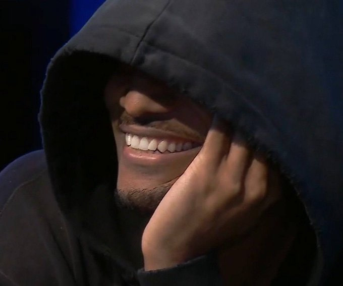 A man with a mustache, wearing a black hoodie pulled over his head, smiles warmly while resting his hand near his face. The image evokes the meme-style "GM" (good morning) vibe referenced in the post, matching the bullish, hype-driven crypto community tone of the $DEALER token announcement.