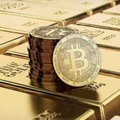A close-up of a physical Bitcoin coin standing upright on a stack of coins, surrounded by gold bars labeled 'Fine Gold'.