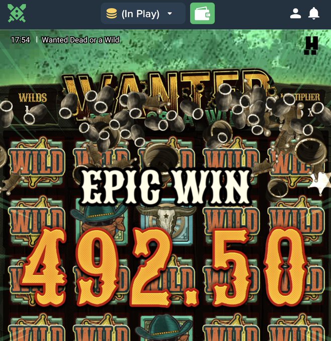 A screenshot from the slot game "Wanted Dead or a Wild" by Hacksaw Gaming displays an "EPIC WIN" of 492.50, with bullet holes overlaying the reels in line with the post celebrating a big hit and promoting SOL wallets for drops.