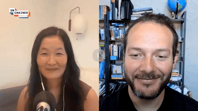 A split-screen video podcast features two people; the left shows an East Asian woman, and the right shows a bearded man, with the 'UNCHAINED' podcast logo visible in the top left.