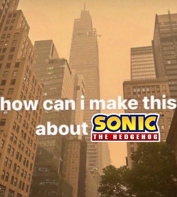 A cityscape with tall buildings overlaid with text reading 'how can i make this about SONIC THE HEDGEHOG', featuring the Sonic logo.