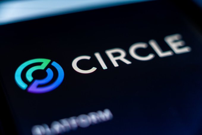 Close-up of a smartphone screen displaying the Circle cryptocurrency app logo with its distinctive green and blue circular design.