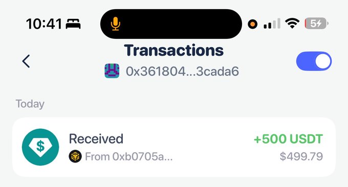 The image shows a cellphone screen displaying information about recent transactions. It includes details such as the transaction amount of $570, which has just been hit this week. The phone displays the time as 10:41 am and indicates that today's transactions list is available on the screen. In addition to this information, there is also a blue button labeled "transactions" for viewing more transaction-related details.