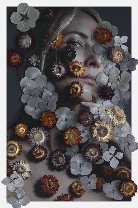 The image features a woman's face with flowers covering her eyes, creating an artistic and surreal effect. The background of the photo appears to be black, which contrasts with the colorful flowers surrounding the woman's face. The caption "Good morning! Chaos 10/15" suggests that this image was taken on a day when chaos or disarray is prevalent, possibly during the morning hours.

The post also mentions an event happening at 10:15, but it does not provide any additional information about what kind of event it might be related to.