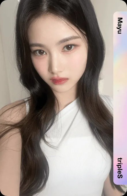 A close-up portrait of a young woman with long dark hair wearing a white top, with text reading 'Mayu' and 'triples' visible on the right side.