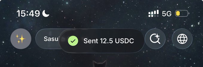 A phone screen at 15:49 displaying a notification of 'Sent 12.5 USDC' on a starry background.