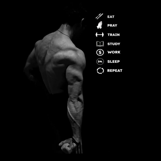 Black and white motivational poster showing a muscular man's back with a list: EAT, PRAY, TRAIN, STUDY, WORK, SLEEP, REPEAT.