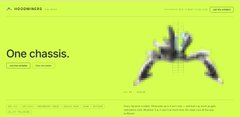 A highly motion-blurred advertisement with a bright yellow-green background, showing a dark, abstract central shape and partially legible text including 'One chassis'.