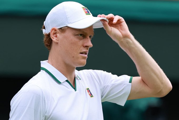 A young tennis player in a white Nike cap and polo shirt tips his hat, appearing focused amid the Wimbledon tournament. The image accompanies news of a massive $760,000 bet on Jannik Sinner to defeat Novak Djokovic.