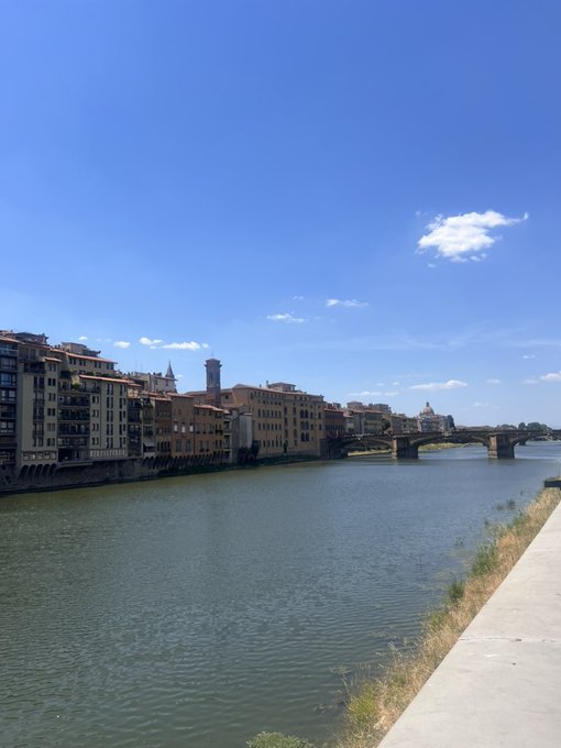 A scenic view of a river winding through a historic European city, featuring old stone buildings, a bridge, and a church dome under a bright blue sky. The image doesn't directly relate to the post's theme of Sunday crypto grinding ($HBAR, $XRP), as it shows no text, numbers, or tickers, but its peaceful, sunny morning atmosphere contrasts with the hustle of building on a Sunday.