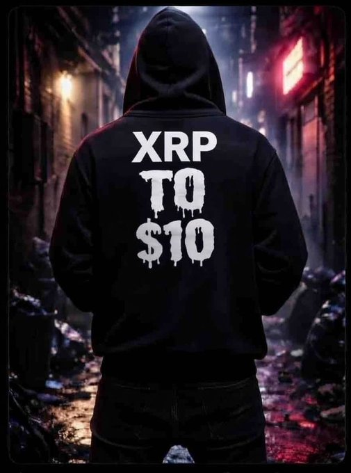 A hooded figure wearing a black hoodie with 'XRP TO $10' painted in white drip-style lettering on the back, standing in a dark alleyway.