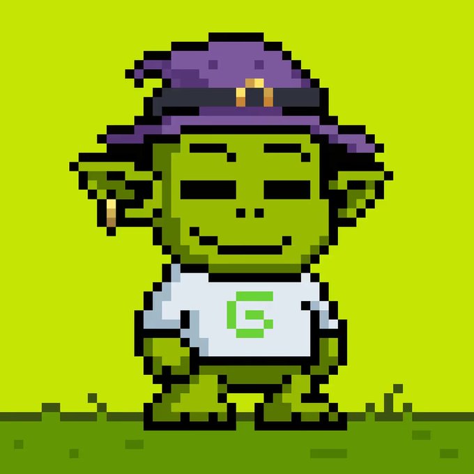 A pixel art image of a green-skinned character wearing a purple witch hat and a white shirt with a green 'G' logo.