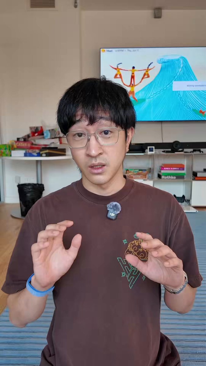 The image shows a man wearing glasses, holding up a brown shirt with a picture of a cat on it. He appears to be posing for a photo or video. The caption below the image reads "How clipping helped @fomo hit trending before our perps launch". This suggests that the man's shirt might have been featured in a popular online platform or social media account, where the cat picture gained significant attention and popularity among users.