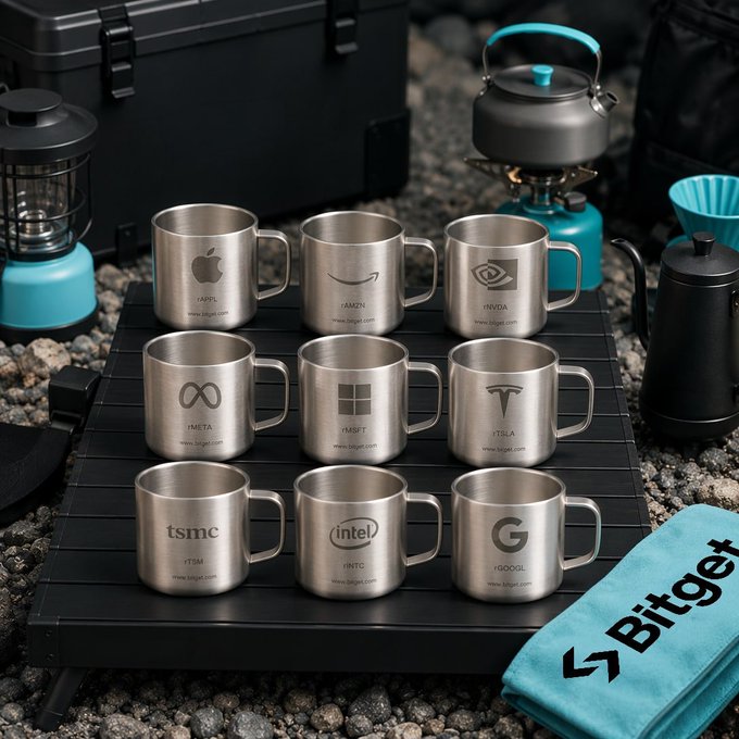 An arrangement of stainless steel mugs branded with logos of tech companies including Apple, Amazon, Nvidia, Meta, Microsoft, Tesla, TSMC, Intel, and Google sits on a camping table next to a Bitget towel.