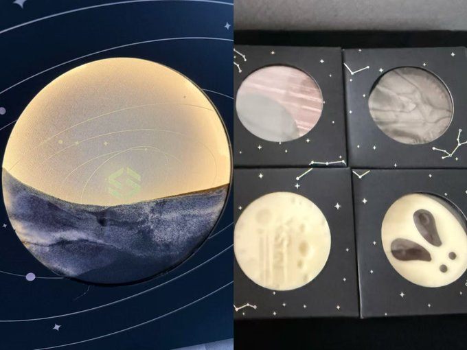 The image shows a split view of a celestial-themed Mid-Autumn gift box by MaiTong: the left panel displays the box's lid with a stunning gradient design featuring a golden moon transitioning into blue waves against a starry background, while the right panel reveals four individually packaged cookies/ice cream discs designed to look like planets—each with unique cosmic patterns including pink marble, gray veining, and cream-colored designs with dark craters.
