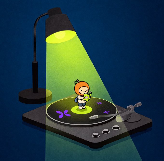 A digital illustration depicts a cute, small character resembling a fruit or vegetable with a leaf on its head, standing on a vinyl record on a turntable and reading a book under the yellow light of a desk lamp.