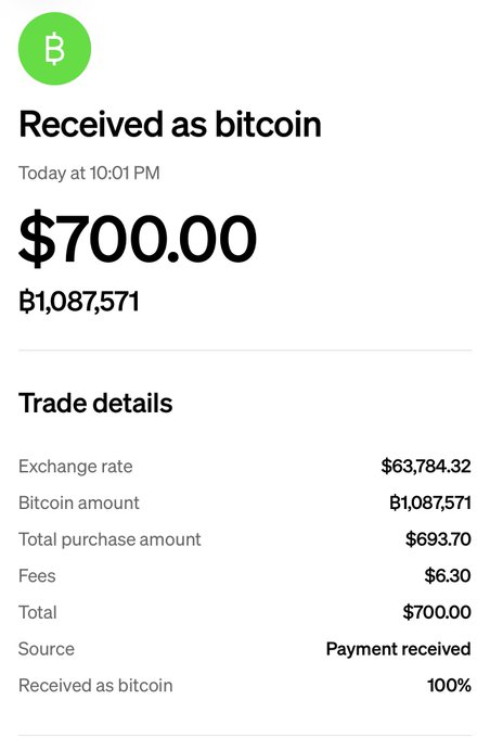 A mobile payment confirmation screen showing $700.00 received as Bitcoin (฿1,087,571) with trade details including fees.