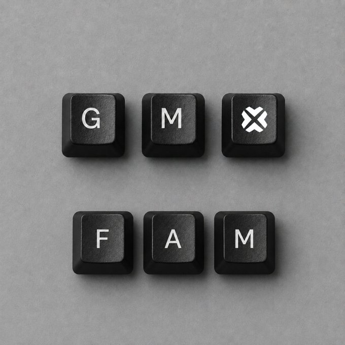 Six black keyboard keys arranged in a grid on a gray surface, with letters spelling 'G', 'M', 'X' on top and 'F', 'A', 'M' on bottom.