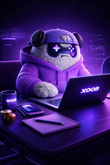 The image features a purple-hued cartoon character sitting at a desk with a laptop computer, surrounded by various objects such as a cup of coffee, a cell phone, and a notebook. The caption reads "Good Morning creators. Wishing everyone a smooth and productive day ahead." This suggests that the creator of this image is promoting a positive and energetic atmosphere for their work or personal projects.
