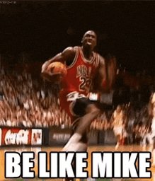 The image features a basketball player jumping up into the air, holding a basketball, with the caption "Be Like Mike" written below him. The background of the image shows a basketball court filled with spectators watching the game.