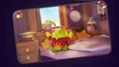 A small green and red cartoon dinosaur character stands in a cozy bedroom scene with a bed, nightstand, and clock visible.