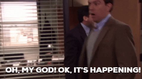 The image features a man wearing a brown suit standing next to a window, with another person partially visible behind him. They are both talking at the same time, as if engaged in a conversation or discussion. The text "oh my God! It's happening!" is written above them, indicating that something unexpected has occurred.