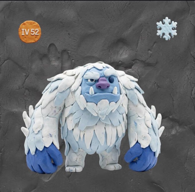 A claymation-style figure of a blue, yeti-like creature covered in white ice or fur with large blue hands, shown against a dark gray background with an "IV 52" cookie icon in the corner.