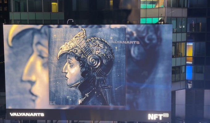 An NFT artwork displayed on a billboard by 'VALYANARTS' on the 'NFT NYC' site, depicting a steampunk-style robotic figure with an ornate helmet.