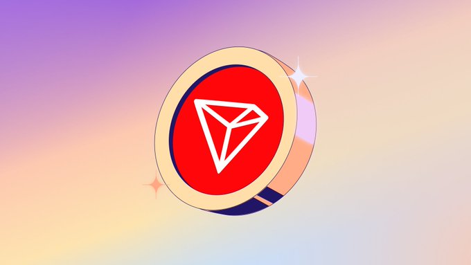 An illustrated red TRON (TRX) cryptocurrency coin spinning against a soft pastel gradient background with sparkle effects.