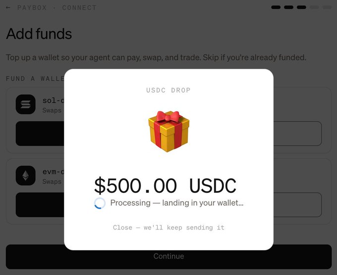 A MoonPay Paybox notification showing a $500.00 USDC drop being processed and landing in the user's wallet, with a gift box icon and "USDC DROP" text. This illustrates the successful resolution of pending claims mentioned in the update, demonstrating the Paybox functioning as expected again after processing the delayed funds.