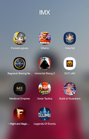 Mobile screen titled 'IMX' showing a folder of mobile game app icons including PocketLegions, Villains, Olderfall, Ragnarok Shaning He..., Immortal Rising 2, OUTLAW, Medieval Empires, Voxie Tactics, Guild of Guardians, Might and Magic..., and Legends Of Elumia.