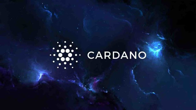 The image displays the "CARDANO" logo in white text alongside its distinctive dot-cluster symbol, set against a vibrant cosmic nebula background in shades of blue and purple. The branding visually reinforces the accompanying news about $ADA's recent price momentum and growing interest in the altcoin, with the stellar backdrop evoking themes of growth and expanding potential for the cryptocurrency.