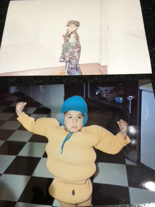 Two childhood photos show the account holder as a toddler dressed in a camouflage outfit in one image and a yellow snowsuit with a blue cap in the other, playfully posing as "the one who runs this account."