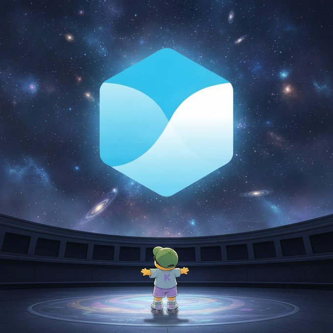 A small animated frog-like character wearing a cap and a shirt with the letter 'K' stands with arms outstretched in a futuristic room, looking up at a massive, glowing blue hexagonal logo against a starry cosmic background.