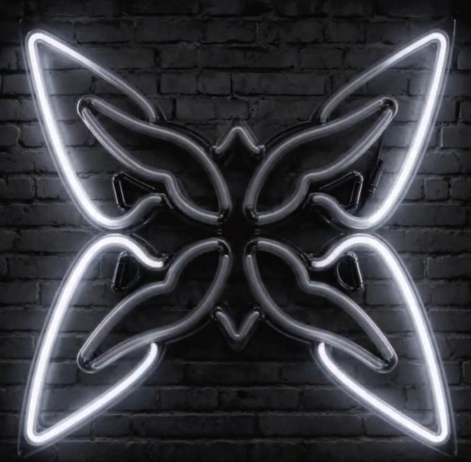 Black and white neon butterfly sign mounted on a dark brick wall, glowing brightly.