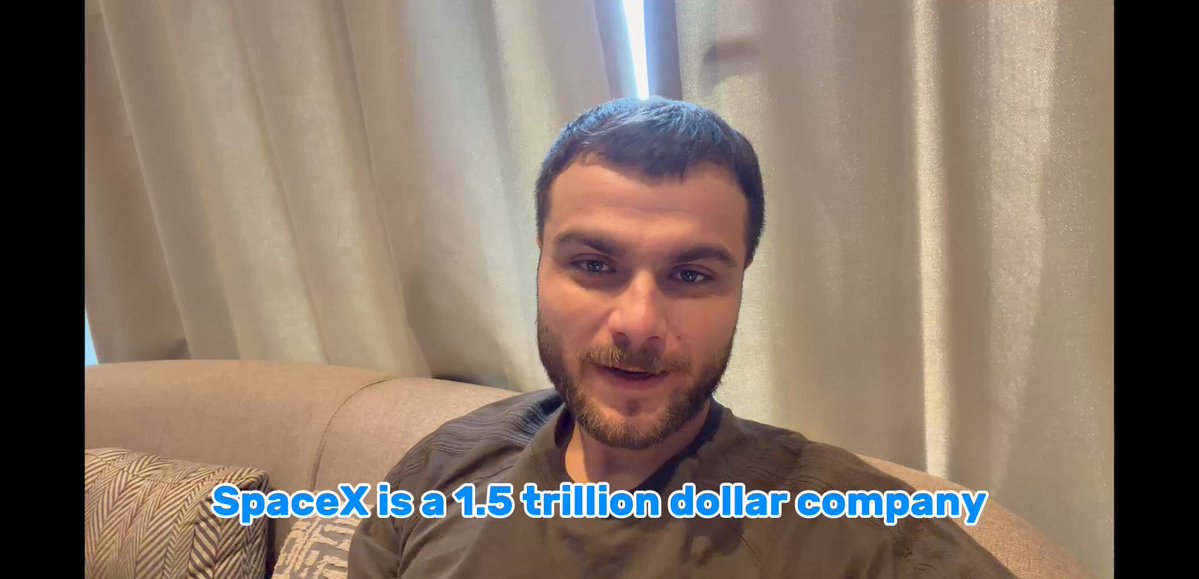 In this image, there is a man sitting comfortably on a couch with his face appearing close-up. The background of the image features a window, which has curtains drawn across most of it. The text displayed in the image reads, "For most of history, getting into a company before it went public was a game only the wealthy were allowed to play spacex is the current version of that, a $1.5 trillion company walled off behind accredited investor requirements @MEXC is opening a second window around it". The man sitting in front of the curtain appears to be smiling for the camera, adding a positive vibe to the image.
