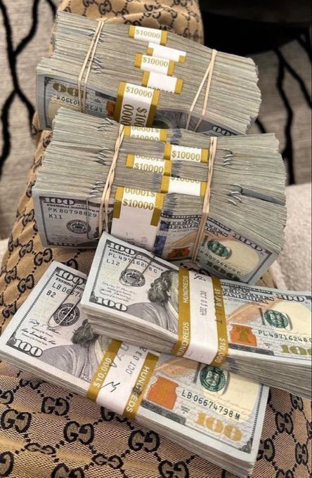 A stack of $10,000 cash bundles in $100 bills rests on a Gucci-patterned surface, directly illustrating the "$10,000" surprise reward promised in the lucky number giveaway. The strapped bundles, labeled "$10000," reinforce the cash prize awaiting the 20 random winners selected from the numbers 20–72.
