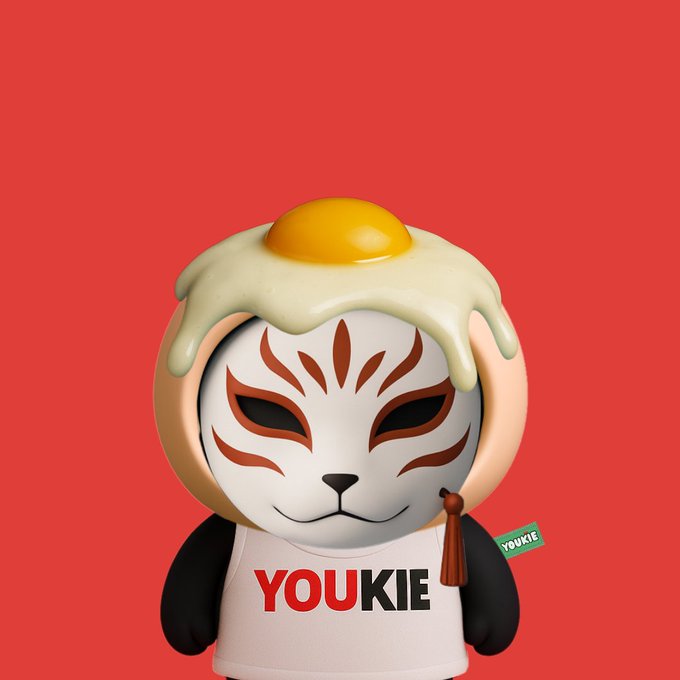 3D-rendered cartoon character with a white fox-like mask, a fried egg on its head, and a shirt reading 'YOUKIE' against a red background.