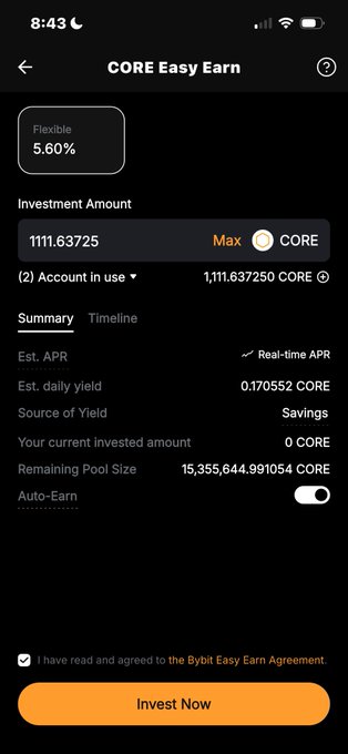 The image shows an iPhone screen displaying information related to Core Easy Earn, a cryptocurrency investment platform. The screen displays details about the flexibility of the platform, such as the ability to invest funds at any time and the potential for daily returns on invested capital. It also highlights that users can access their funds whenever they want, making it convenient for them. The image is accompanied by text that explains how Core Easy Earn works and its benefits compared to traditional staking methods.