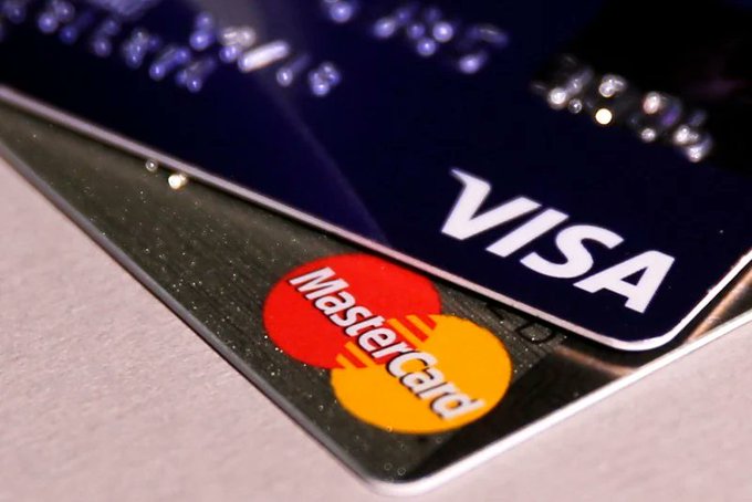 A close-up of two credit cards showing the 'VISA' and 'MasterCard' logos.