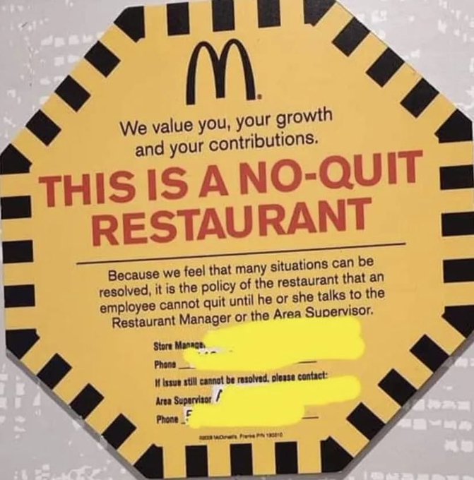 A yellow McDonald's sign with black checkered border reads 'We value you, your growth and your contributions. THIS IS A NO-QUIT RESTAURANT' and explains the policy that employees cannot quit without speaking to a Restaurant Manager or Area Supervisor.